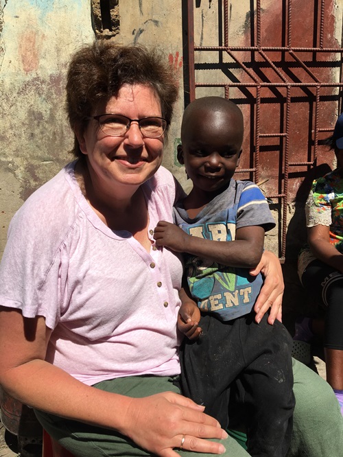 Michelle Meade with young boy in Africa