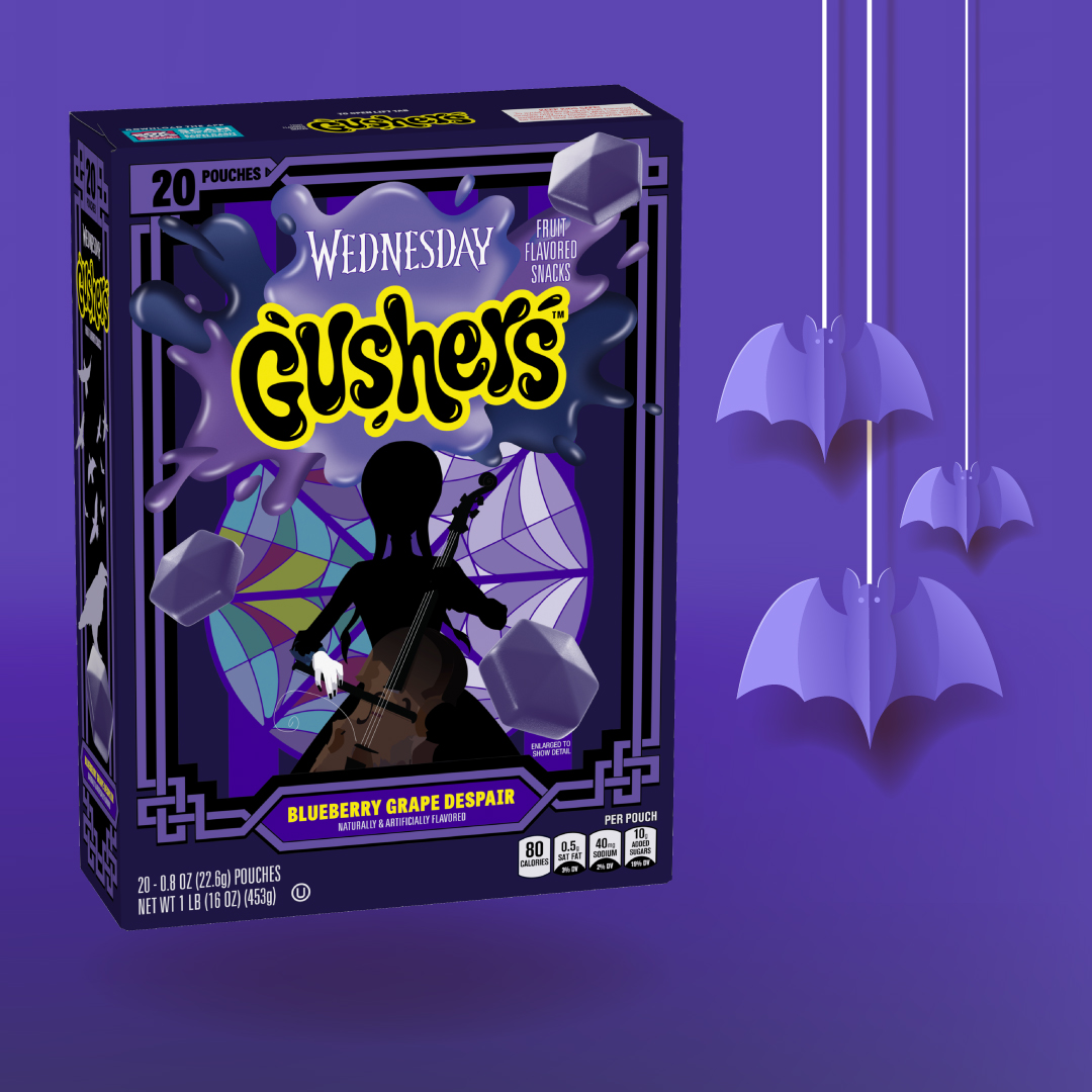 Gushers Wednesday Fruit Snacks box displayed on a purple background with bat illustrations.